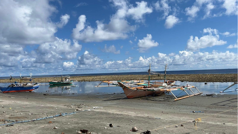 Fishing boats in Barangay Pangyan, Glan, Sarangani, are trapped as the shoreline receded by 200 meters following the coastal uplift caused by the June 8 magnitude 7.8 earthquake (Photo Credit: Jelo Ritzhie Mantaring/Rappler)